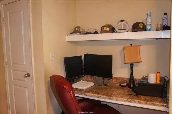 a view of a workspace with furniture