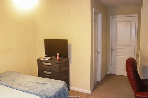 a bedroom with a bed and furniture