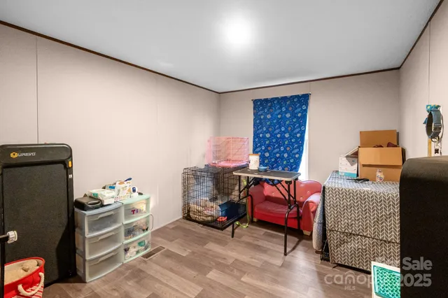 a bedroom with furniture and a window