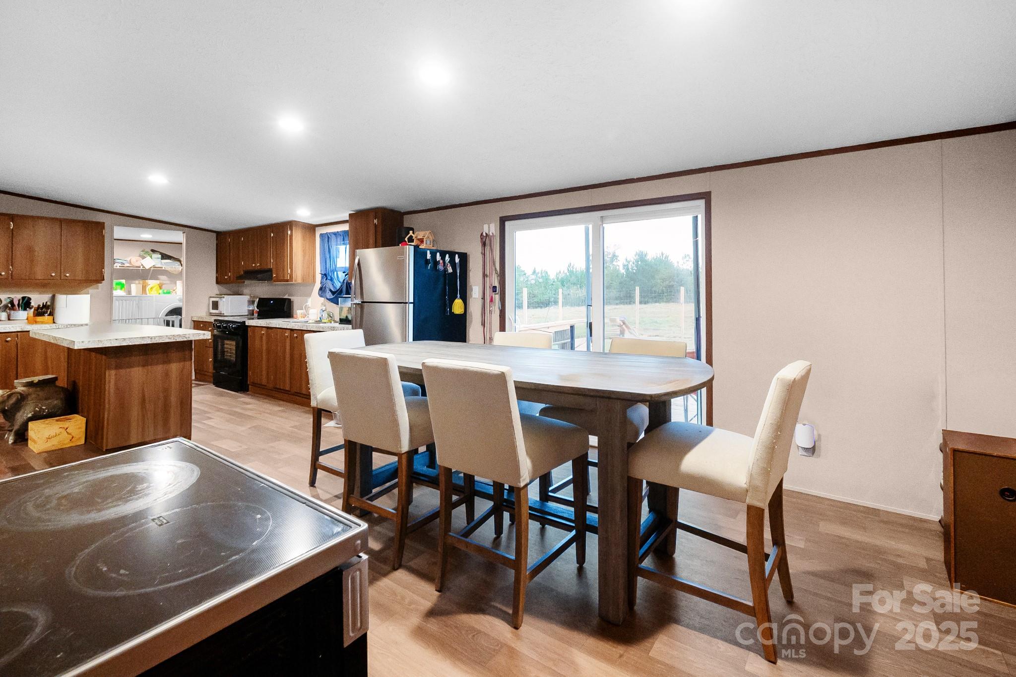 5263 Raleys Mill Road Bethune, SC 29009 - Photo 14 of 37 a view of a dining room with furniture window and outside view