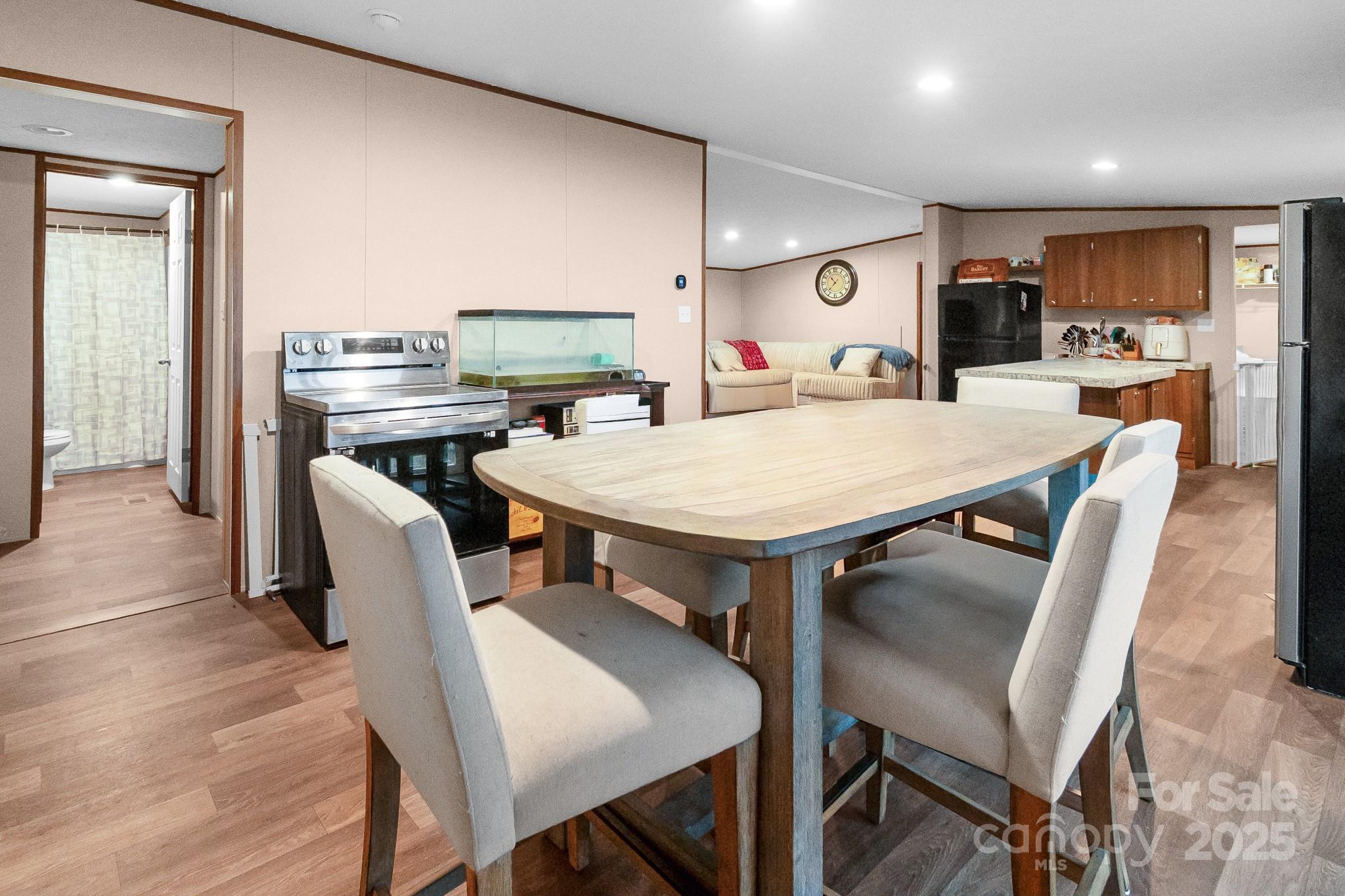 5263 Raleys Mill Road Bethune, SC 29009 - Photo 17 of 37 a view of a dining room with furniture and wooden floor
