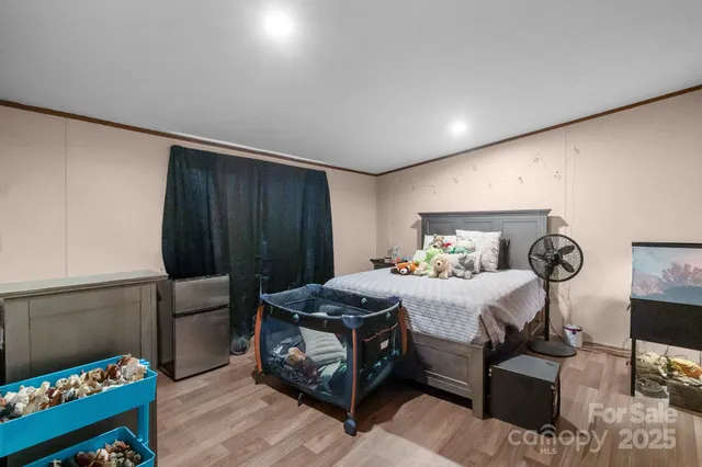 a bedroom with a bed and a table in it