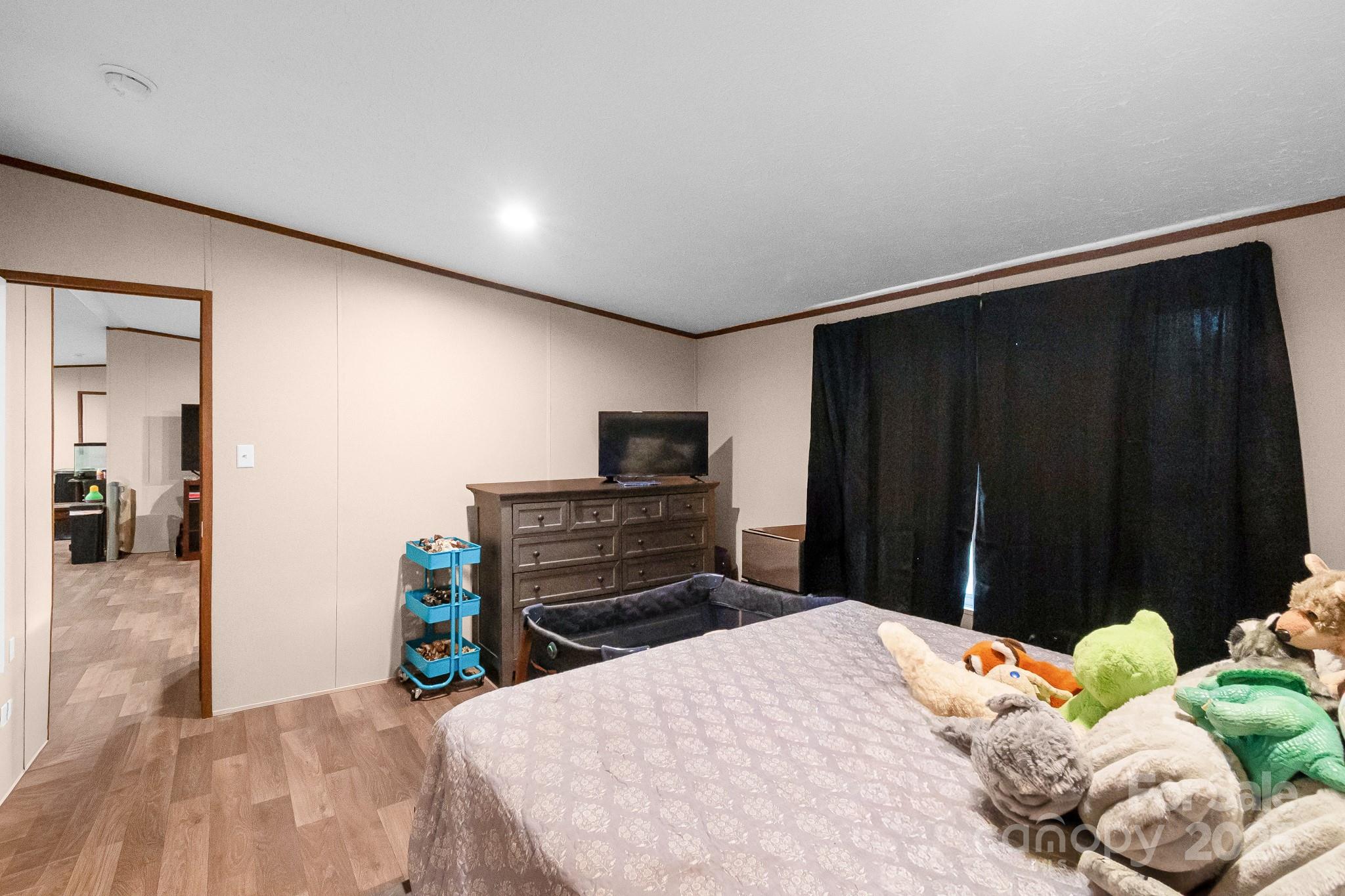 5263 Raleys Mill Road Bethune, SC 29009 - Photo 20 of 37 a bedroom with a bed and a television