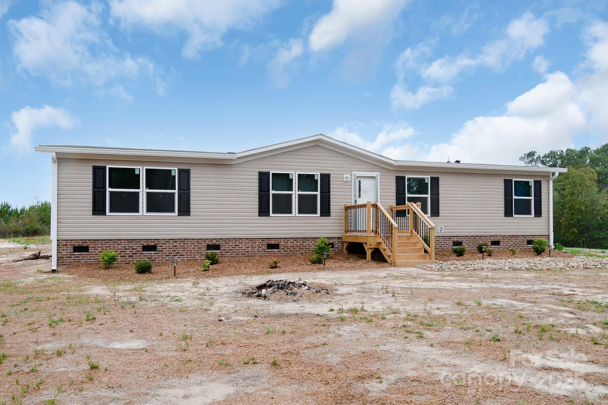 5263 Raleys Mill Road Bethune, SC 29009 - Photo 2 of 37 a front view of a house with sitting area
