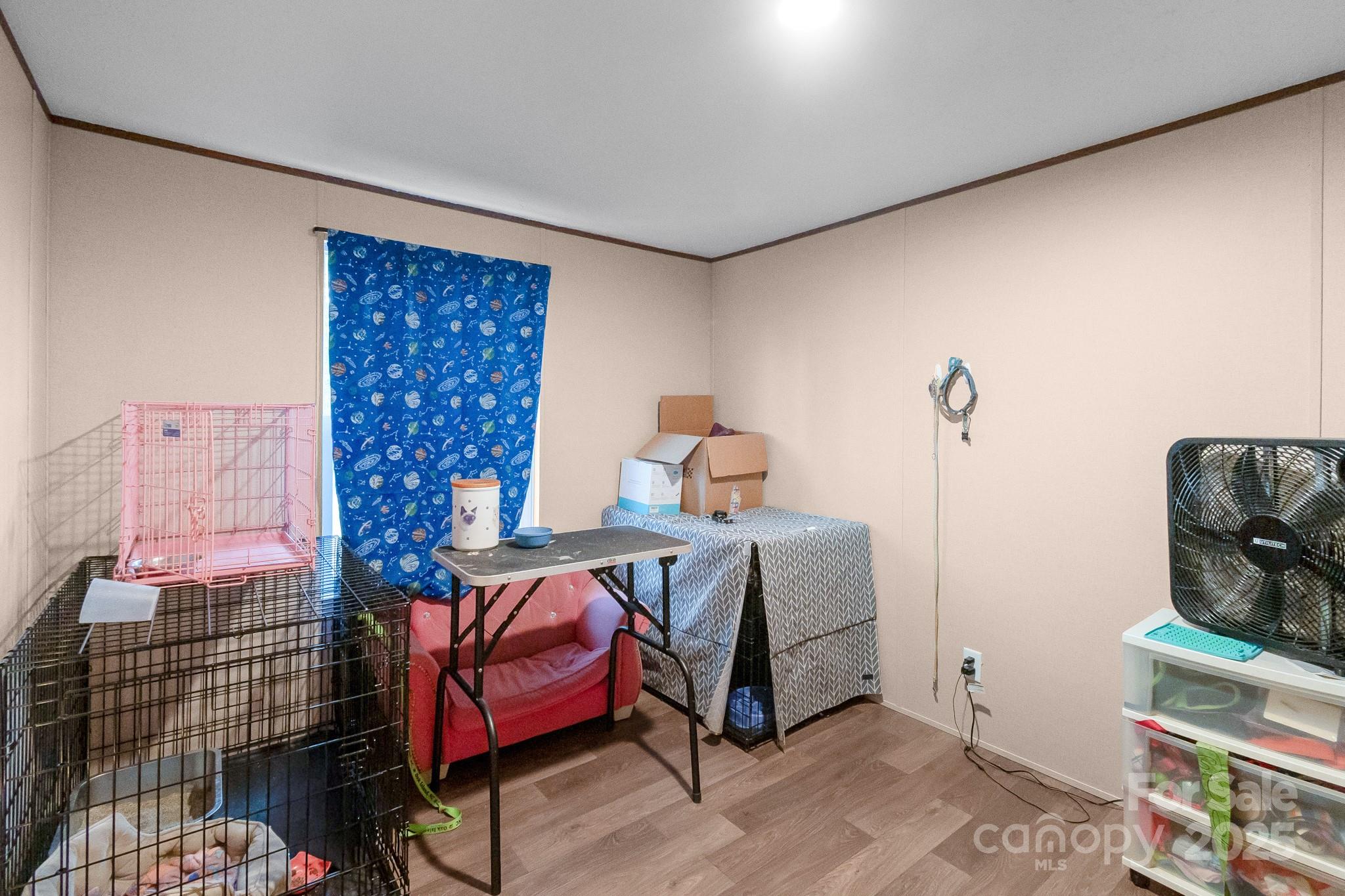 5263 Raleys Mill Road Bethune, SC 29009 - Photo 26 of 37 a bedroom with a bed and wooden floor