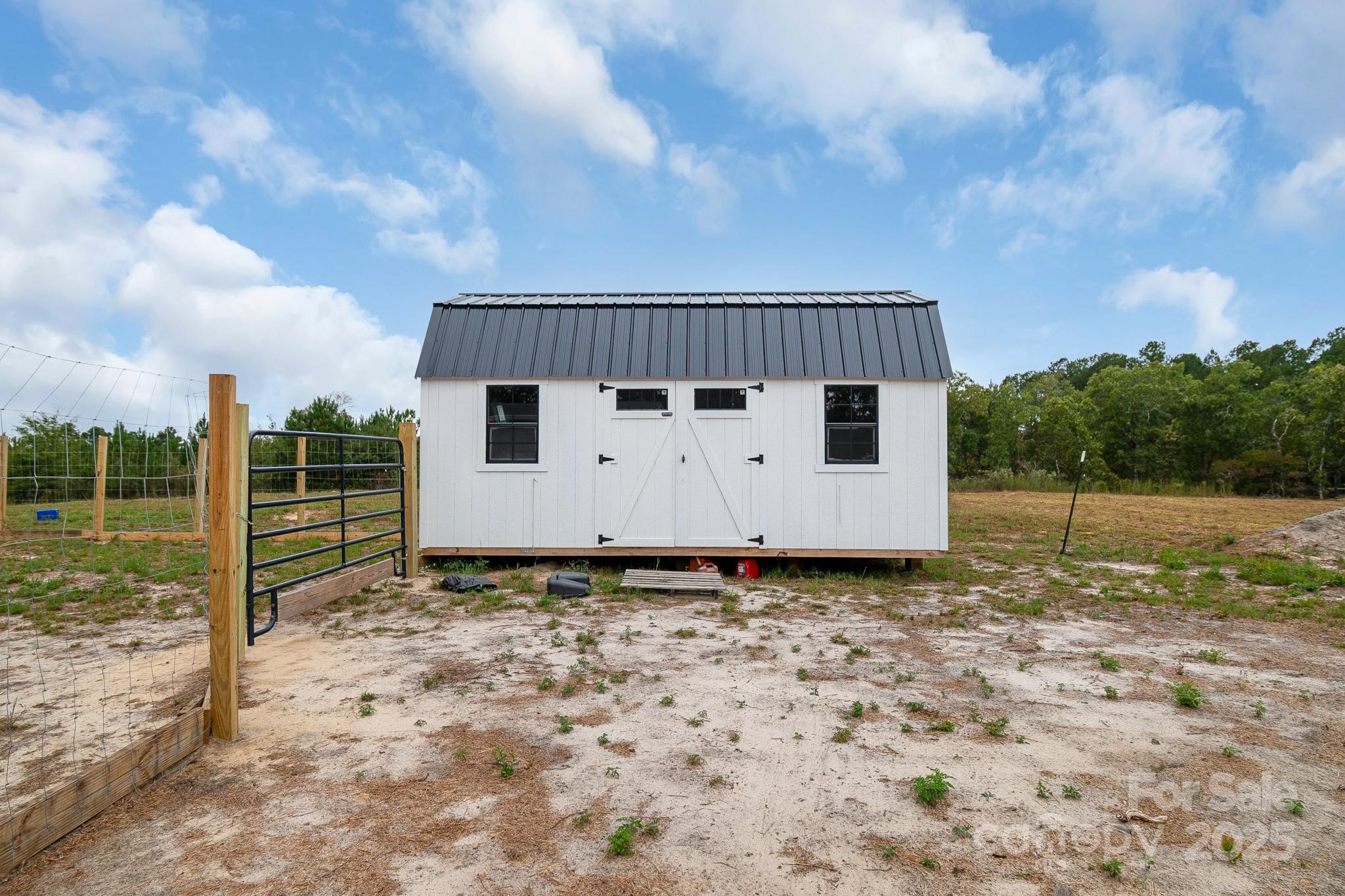 5263 Raleys Mill Road Bethune, SC 29009 - Photo 28 of 37 a view of a backyard with grass and wooden fence