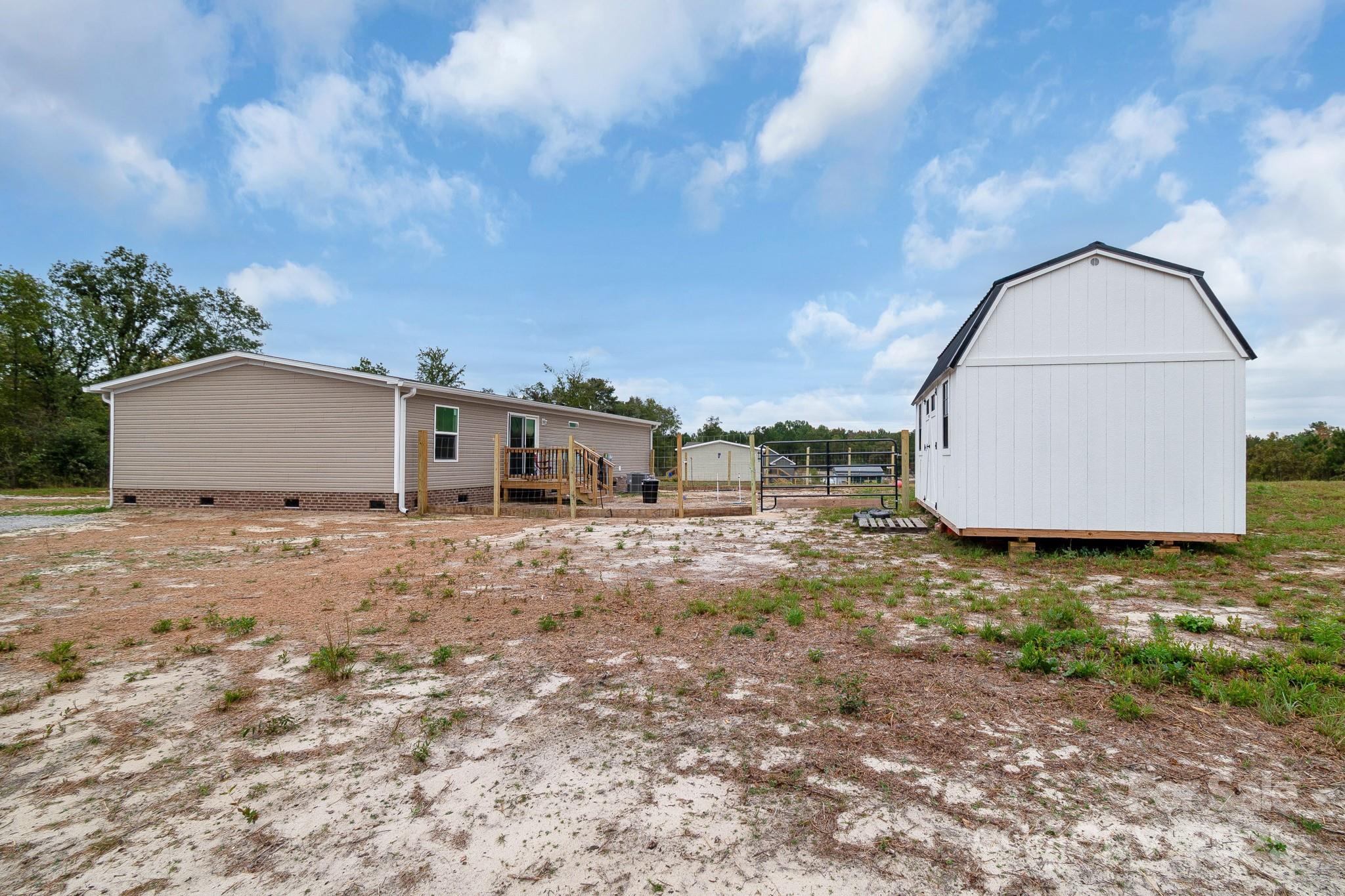 5263 Raleys Mill Road Bethune, SC 29009 - Photo 30 of 37 a view of a dry yard with wooden fence