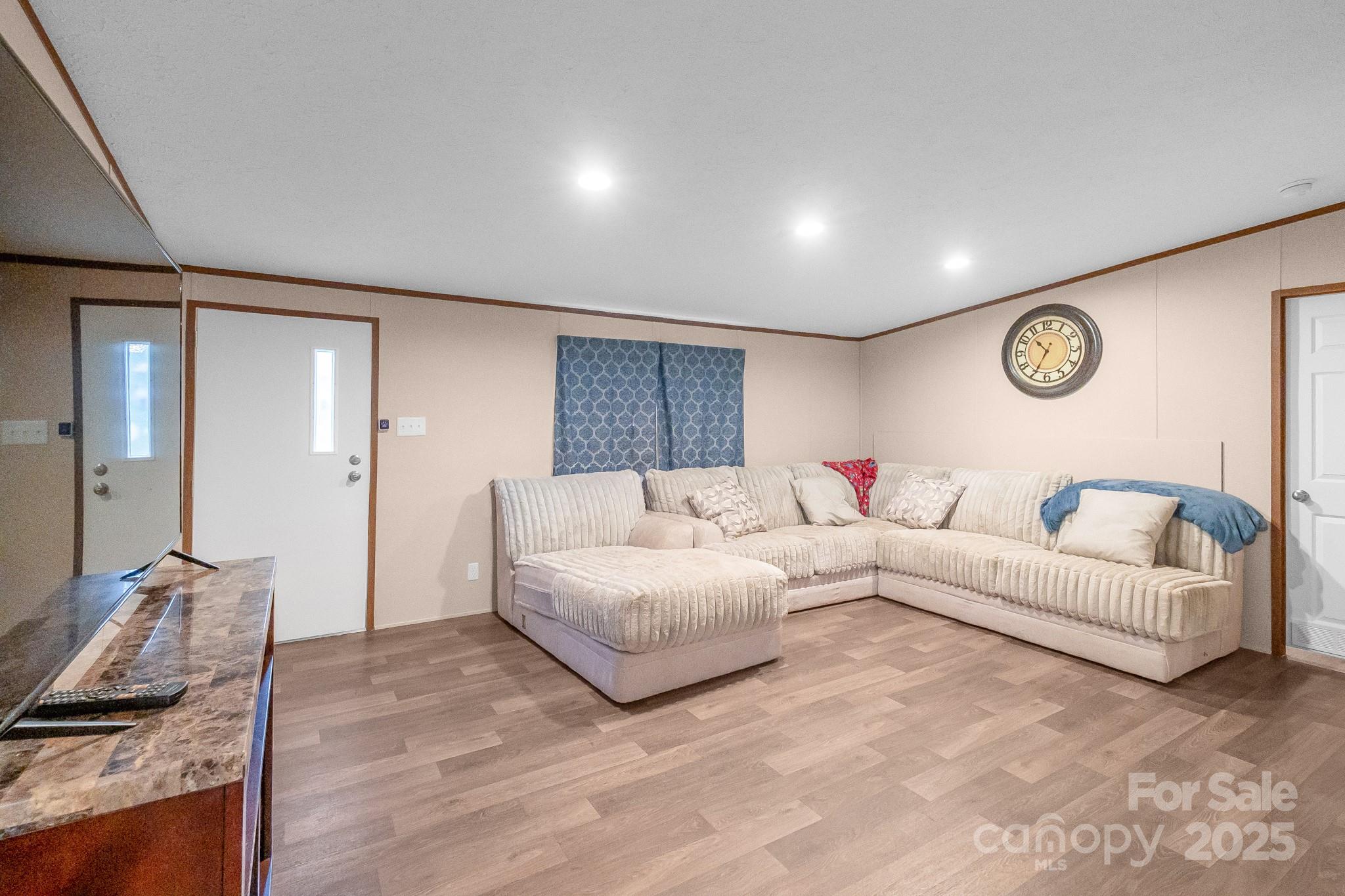 5263 Raleys Mill Road Bethune, SC 29009 - Photo 3 of 37 a living room with furniture wooden floor and a large window