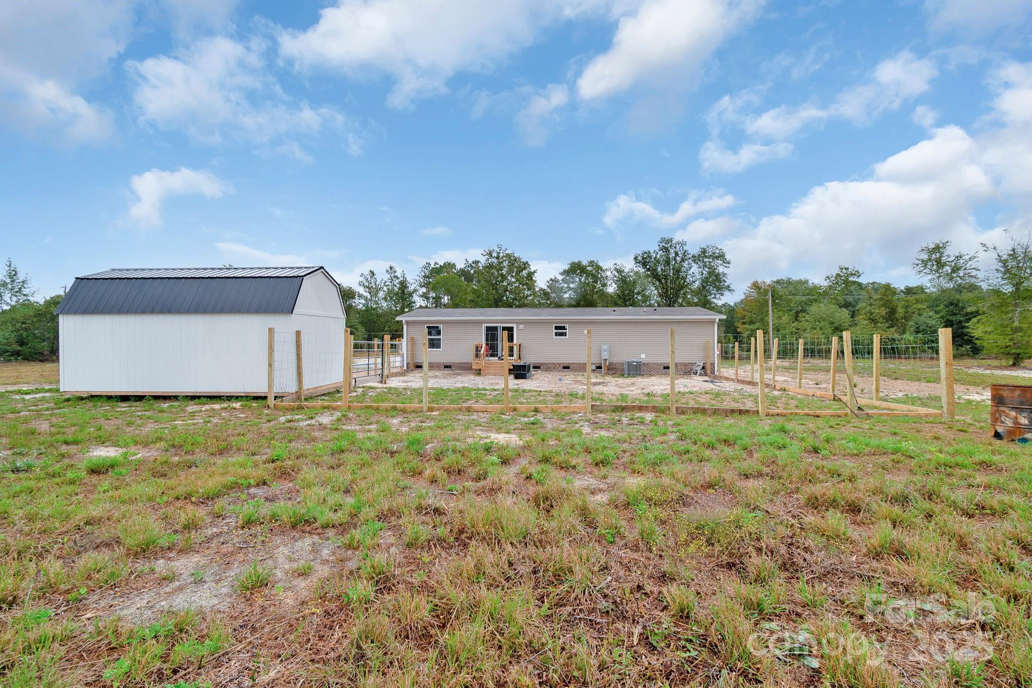 5263 Raleys Mill Road Bethune, SC 29009 - Photo 37 of 37 a view of a garden with a barn