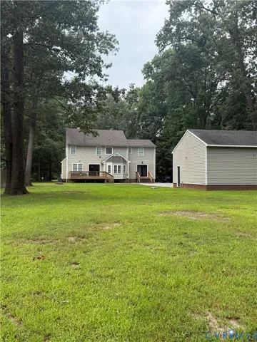 a house view with swimming pool in front of it