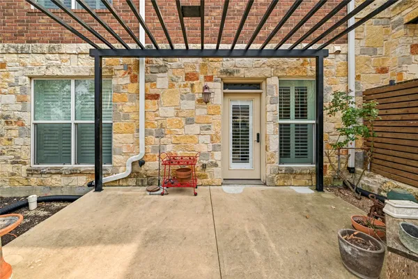 an aerial view of residential houses with outdoor space and parking