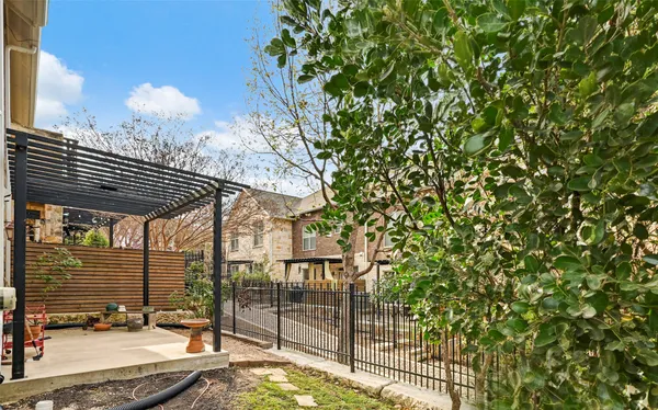 an aerial view of a house with a mountain