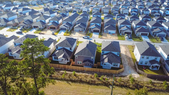 a view of house with a swimming pool