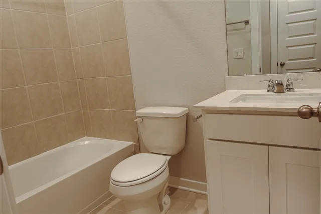 a bathroom with a sink a toilet and bathtub