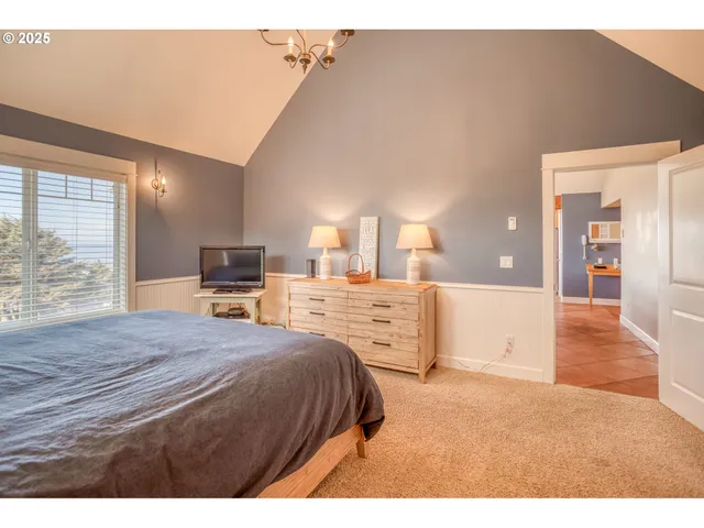 a bedroom with a bed and a view of bathroom