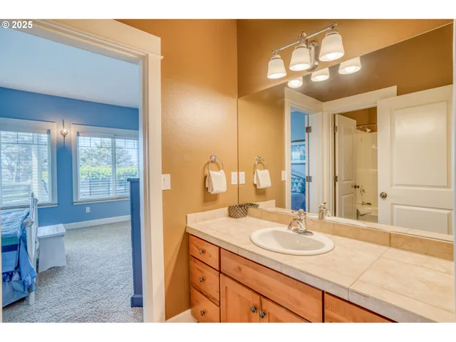 a bathroom with a sink a vanity and a mirror