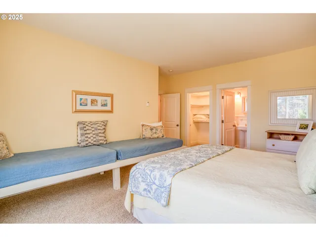 a bedroom with a bed and a night stand