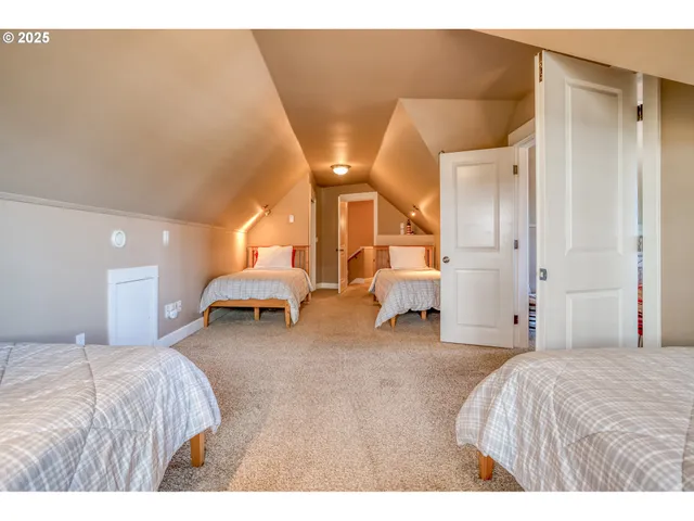 a bed room with a bed and a chair