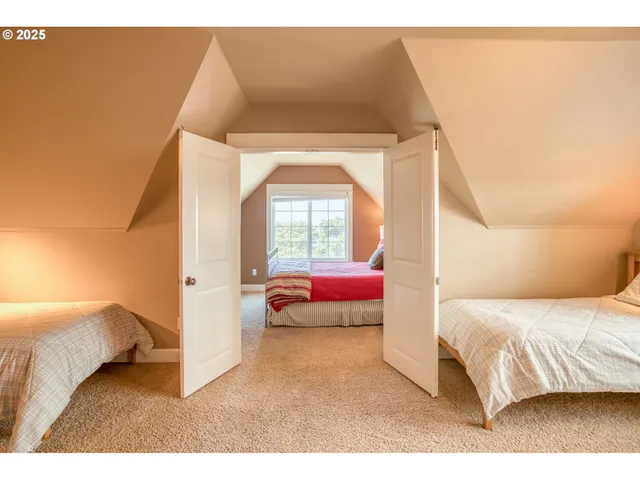 a bedroom with a bed and a potted plant