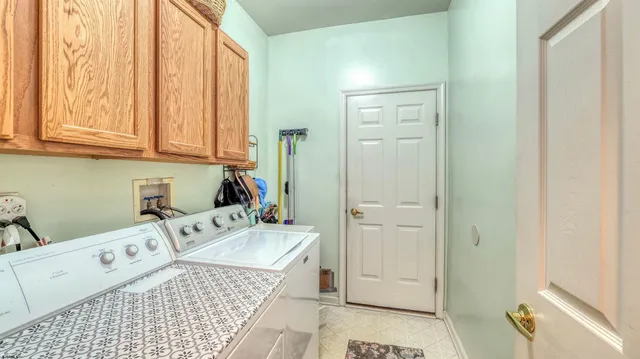 a close view of a sink and cabinets in a bathroom