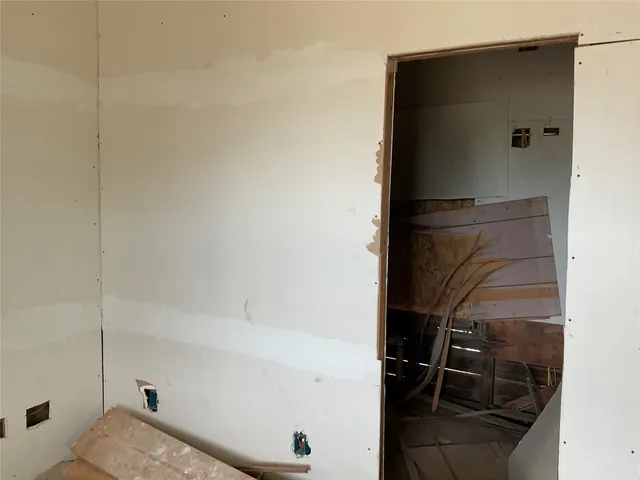 a bathroom with a shower and a toilet