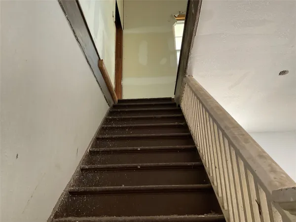 a bathroom with a shower toilet and a sink