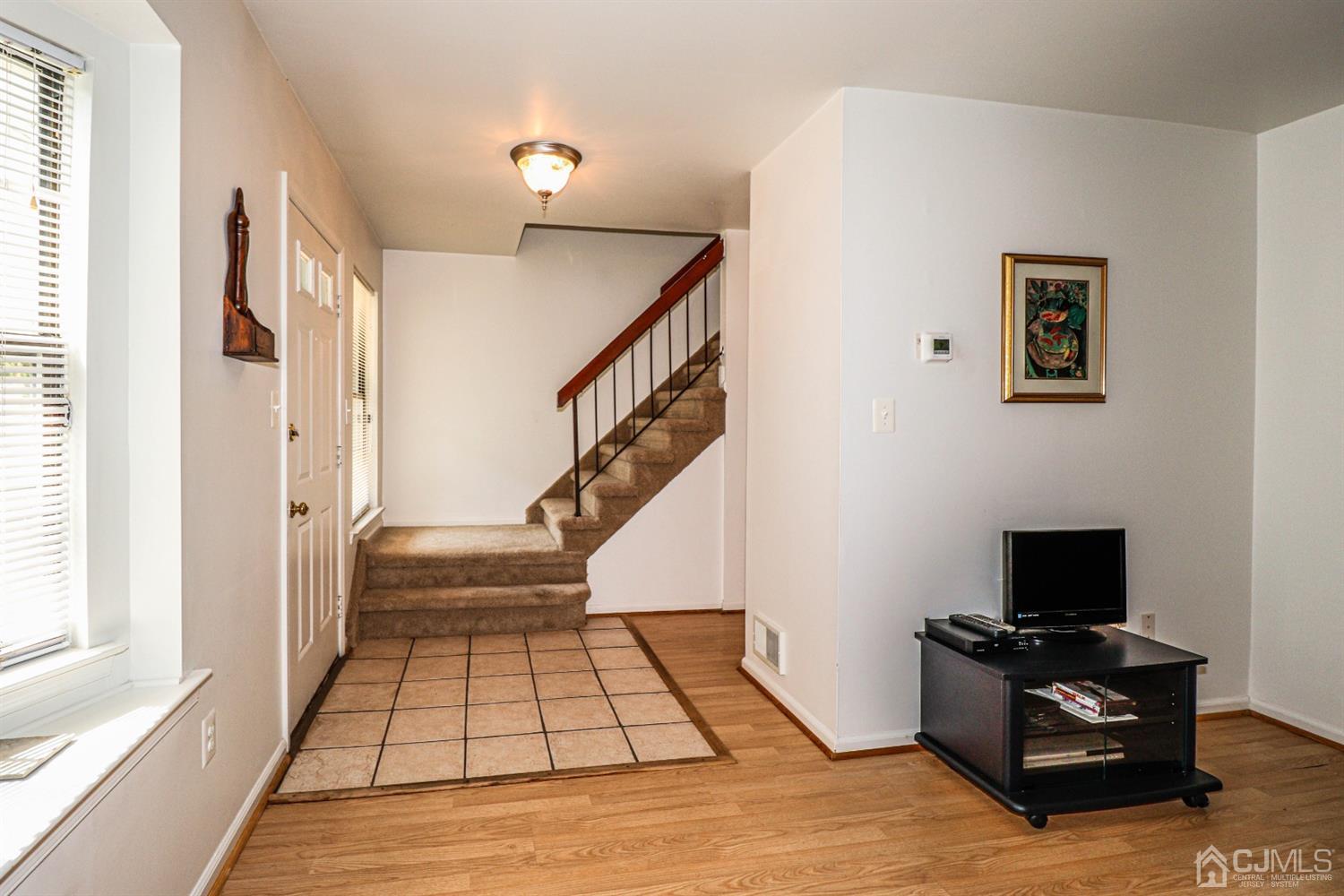 2103 Timber Oaks Road Edison, NJ 08820 - Photo 8 of 33 a view of a livingroom with wooden floor and furniture
