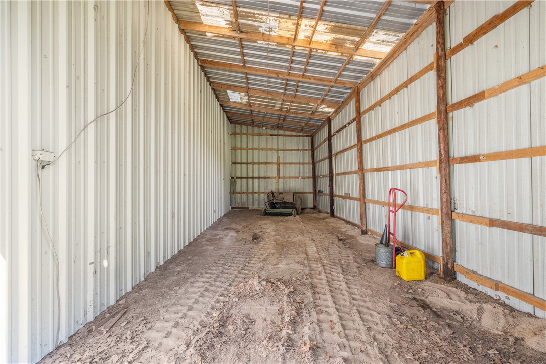 1.921-ac Cardinal Road Caldwell, TX 77836 - Photo 16 of 18 Garage with metal wall