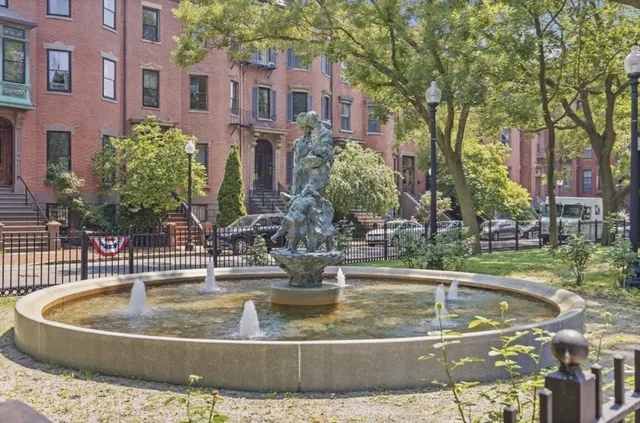 a view of a swimming pool with a fountain