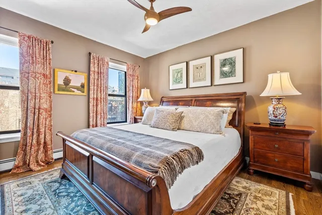 a bedroom with bed and window