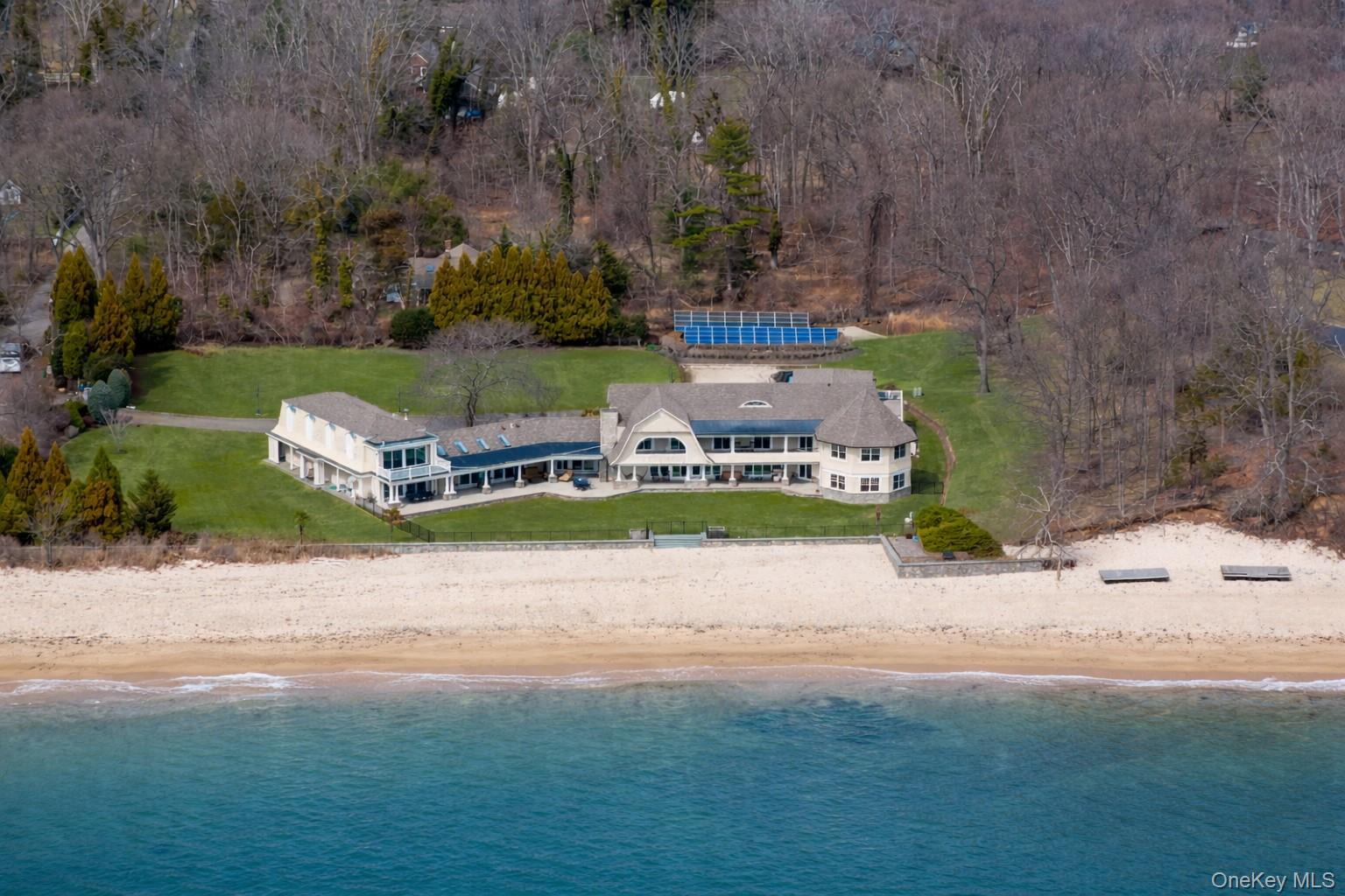 an aerial view of a house with outdoor space pool seating area and yard