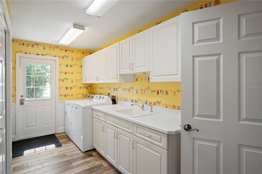 9045 Lake Hatchineha Road Kissimmee, FL 34759 - Photo 38 of 47 a view of a kitchen with a sink