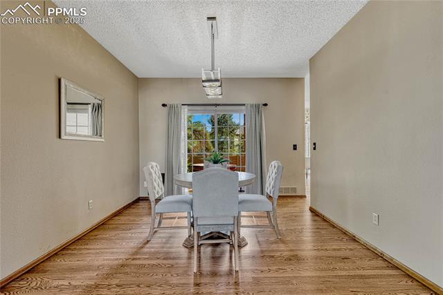 2135 Springcrest Road Colorado Springs, CO 80920 - Photo 22 of 48 Formal dining room provides a walk-out to back patio