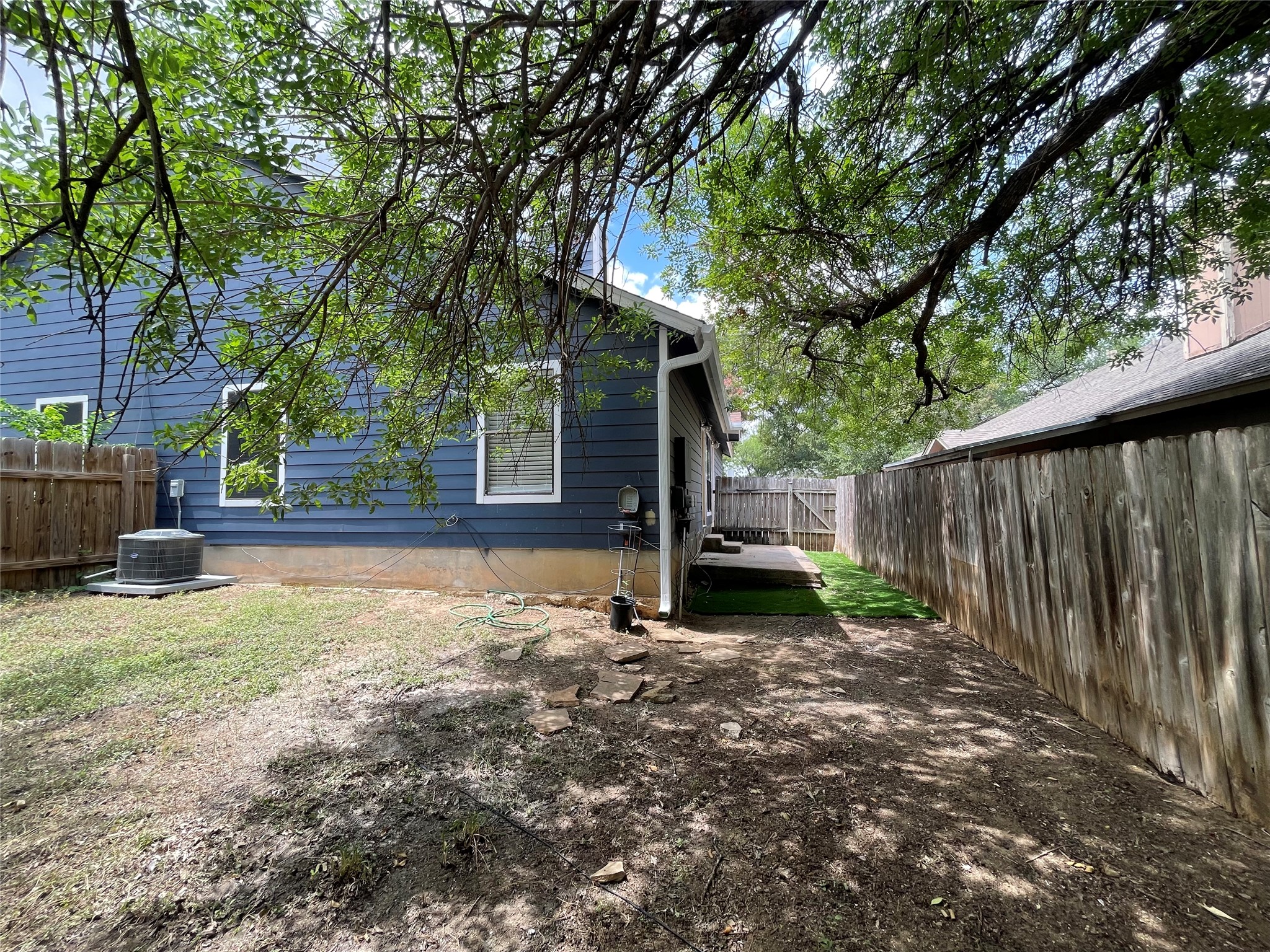 2031 Redwing Way Round Rock, TX 78664 - Photo 23 of 25 A private backyard oasis with mature trees and a fenced perimeter.