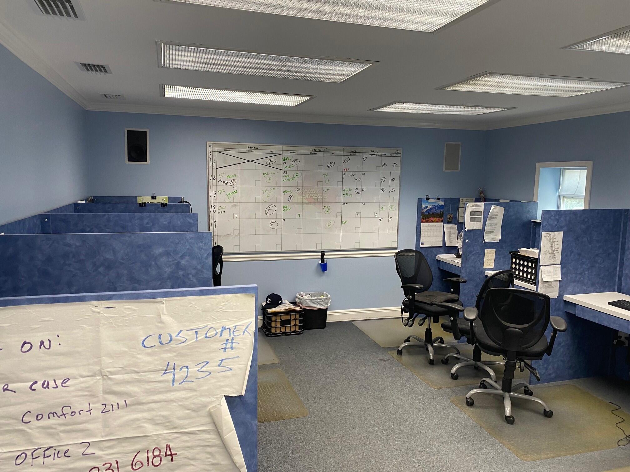 700 South John Rodes Boulevard, Unit B7 & B8 Melbourne, FL 32904 - Photo 4 of 10 a living room with furniture and a piano
