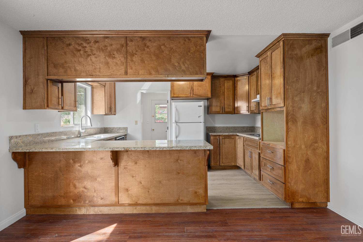 Undisclosed Address Bakersfield, CA 93309 - Photo 14 of 33 a kitchen with stainless steel appliances granite countertop a sink stove and refrigerator