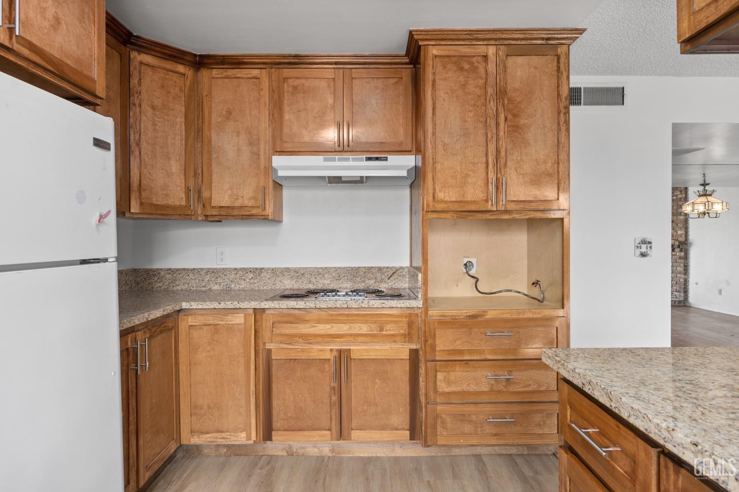 Undisclosed Address Bakersfield, CA 93309 - Photo 15 of 33 a kitchen with granite countertop cabinets stainless steel appliances and a counter space