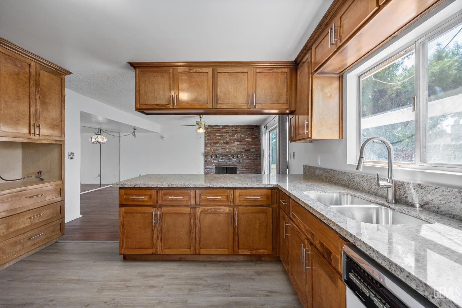 Undisclosed Address Bakersfield, CA 93309 - Photo 17 of 33 a kitchen with stainless steel appliances granite countertop a sink stove and cabinets