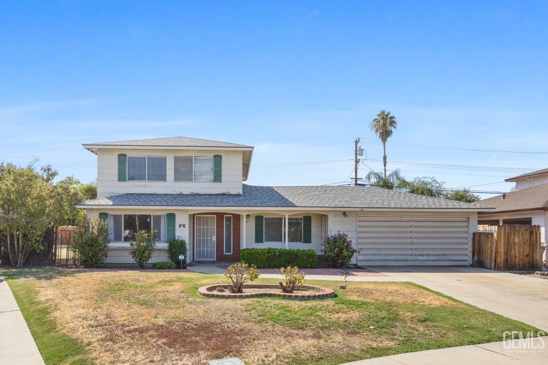 Undisclosed Address Bakersfield, CA 93309 - Photo 2 of 33 a front view of a house with garden