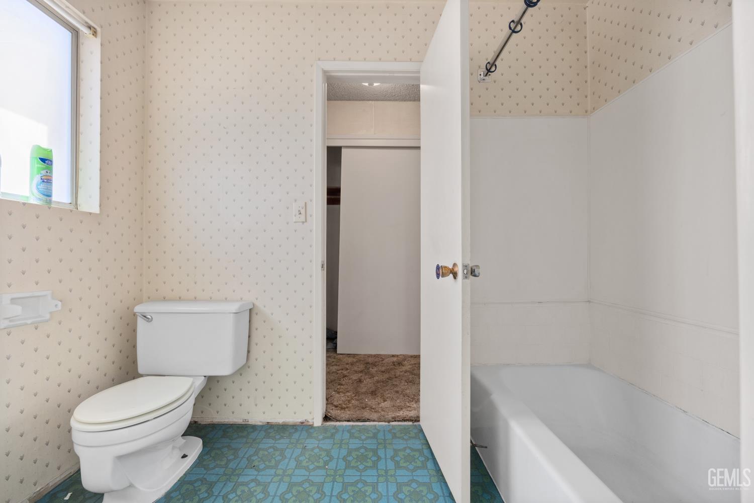 Undisclosed Address Bakersfield, CA 93309 - Photo 21 of 33 a bathroom with a toilet and shower