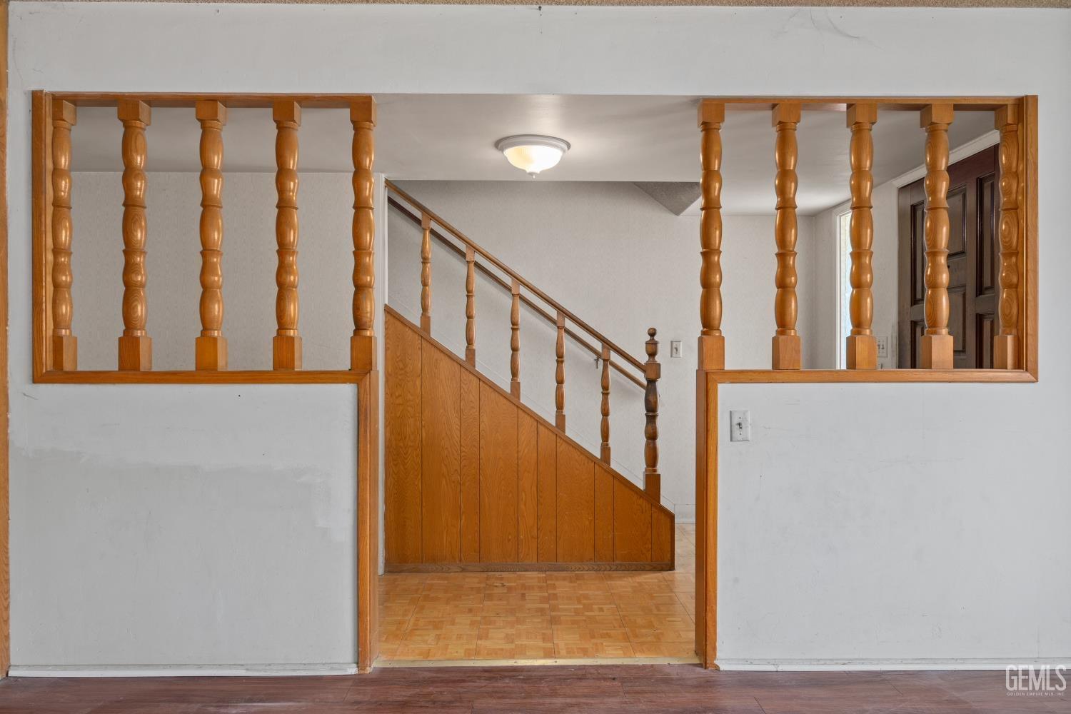 Undisclosed Address Bakersfield, CA 93309 - Photo 9 of 33 a view of staircase with lots of frames on wall and a window