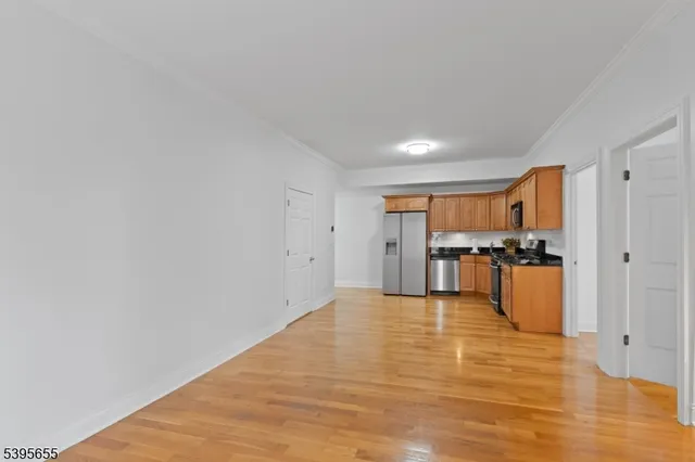 a view of kitchen with wooden floor