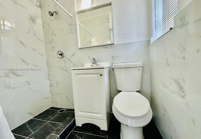 a bathroom with a toilet and a sink