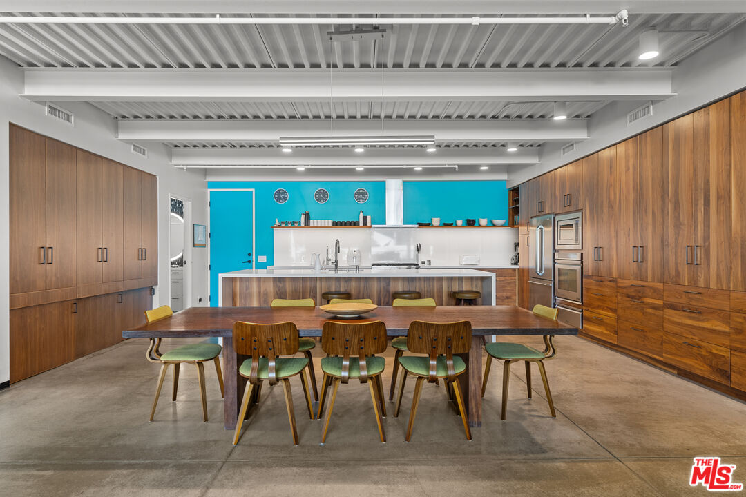 548 Rose Avenue Venice, CA 90291 - Photo 19 of 48 a dinning table and chairs in a kitchen