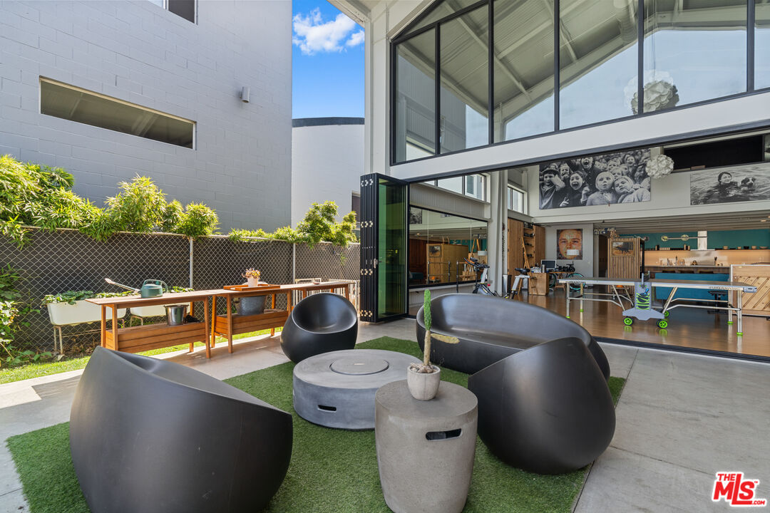 548 Rose Avenue Venice, CA 90291 - Photo 4 of 48 a outdoor living space with furniture and a fireplace