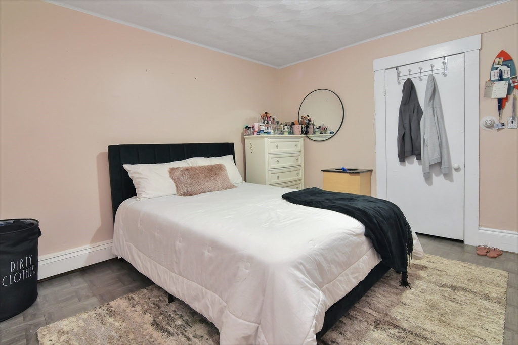 276 Broadway Lawrence, MA 01841 - Photo 18 of 27 a bedroom with bed and a closet