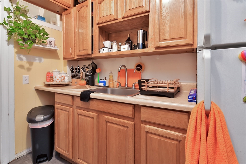 276 Broadway Lawrence, MA 01841 - Photo 20 of 27 a kitchen with stainless steel appliances a sink and a cabinets