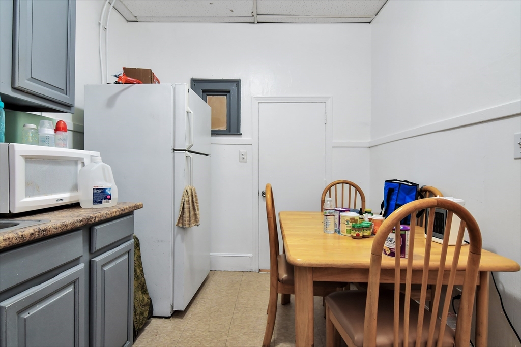276 Broadway Lawrence, MA 01841 - Photo 23 of 27 a dining area with furniture and window