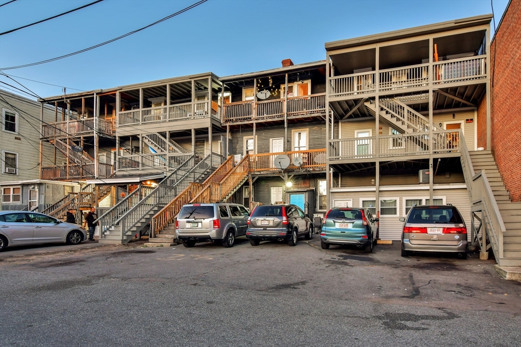 276 Broadway Lawrence, MA 01841 - Photo 24 of 27 a car parked in front of a building