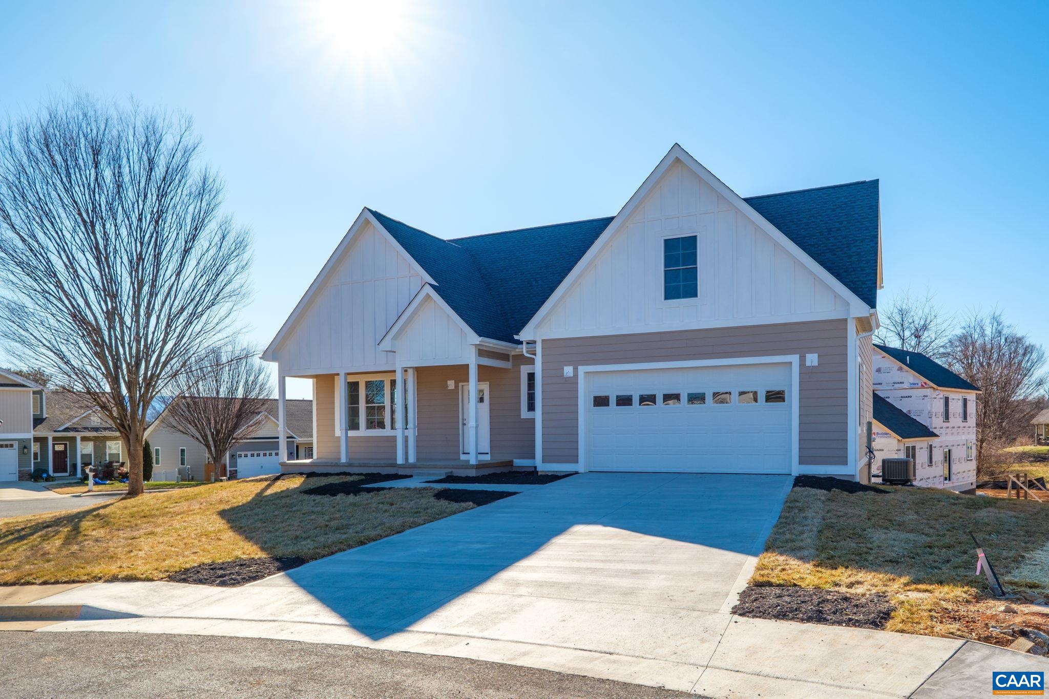 a front view of a house with yard